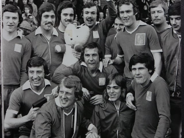 Striker Cozens was the captain of Noel Cantwell's Fourth Division winning side, the only Posh team to go through a Football League season unbeaten at home (19 wins 4 draws). Posh haven't won a title since. Cozens is pictured holding the Fourth Division trophy. He was the club's top scorer that season. Cozens, who is now 76, still lives in the city.