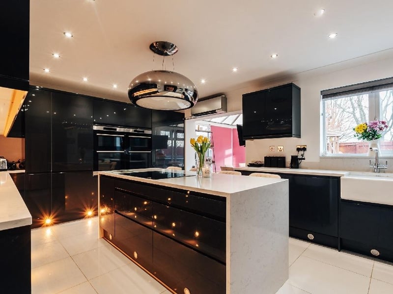 A view of the kitchen with window out to rear garden