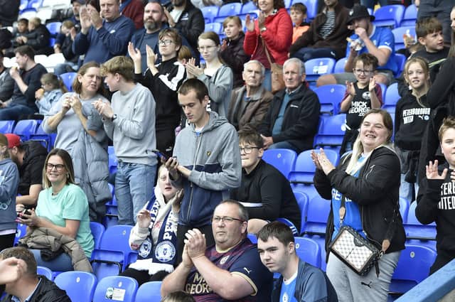 Peterborough United fans are pictured enjoying the win over Bristol Rovers.