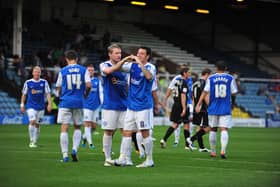 Lee Tomlin (right) and Grant McCann celebrate the former's hat-trick goal for Posh v Ipswich in 2011.