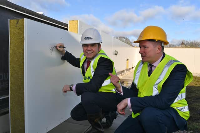 Cambridgeshire and Peterborough Combined Authority Mayor Dr Nik Johnson, left, at the topping out ceremony at the new ARU Peterborough, with university principal Professor Ross Renton.