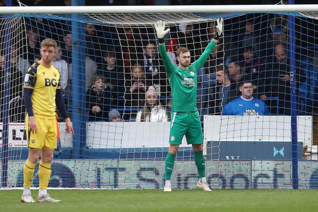 Will Norris prepares for a free-kick to be taken against Oxford on Saturday. Photo: Joe Dent.