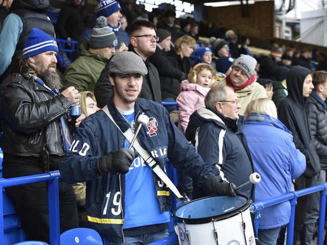 Peterborough United fans watch the 2-1 FA Cup win over Doncaster Rovers.
