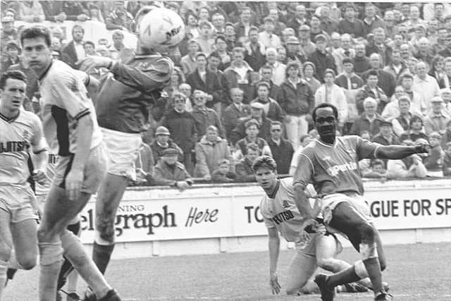 Noel Luke (right) scores for Posh against Cambridge in 1990.
