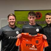 New Peterborough Sports signing Oisin Gallagher with the club's joint managers Michael Gash (left) and Luke Steele (right). Photo: Lillianna Armstrong.