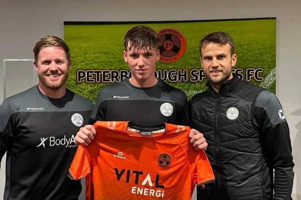 New Peterborough Sports signing Oisin Gallagher with the club's joint managers Michael Gash (left) and Luke Steele (right). Photo: Lillianna Armstrong.