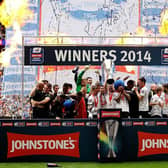 Peterborough United's players celebrate with the trophy after winning the Johnstone's Paint Trophy at Wembley Stadium on March 30, 2014.