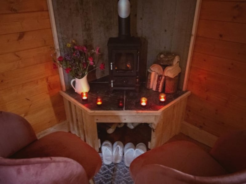 Pop on the provided slippers and snuggle up next to the wood burner.