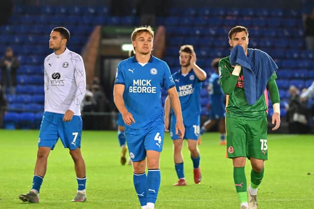Peterborough United's players walk off after defeat to Leyton Orient in the Vertu Trophy. Photo: David Lowndes.