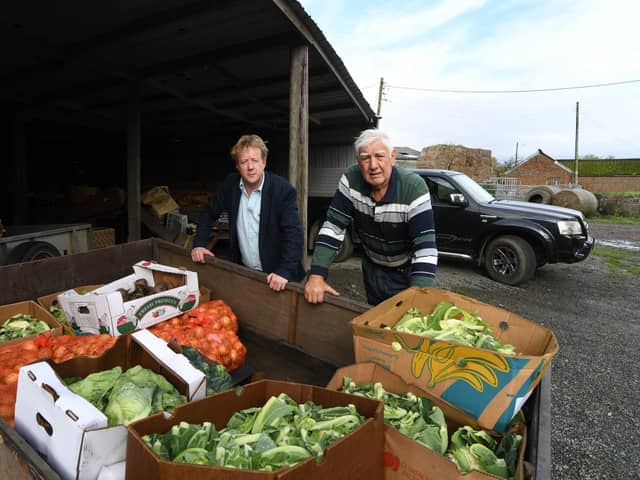 Peterborough MP Paul Bristow with Roy Plummer, a farmer at Newborough,
