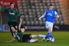 Kelland Watts puts in a crunching challenge on Jack Taylor while on loan at Plymouth in February 2021. (Photo by Dan Mullan/Getty Images)