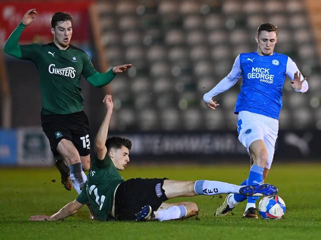 Kelland Watts puts in a crunching challenge on Jack Taylor while on loan at Plymouth in February 2021. (Photo by Dan Mullan/Getty Images)