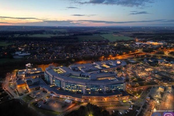 Peterborough City Hospital, looking very state-of-the-art, at dusk.