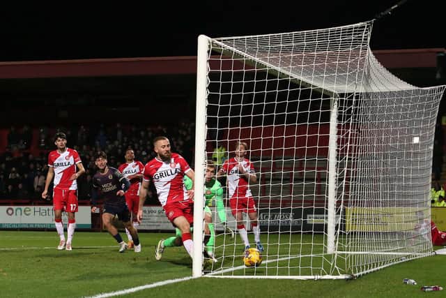 Dan Butler of Stevenage can't prevent Joel Randall from scoring for Posh. Photo: Joe Dent/theposh.com.