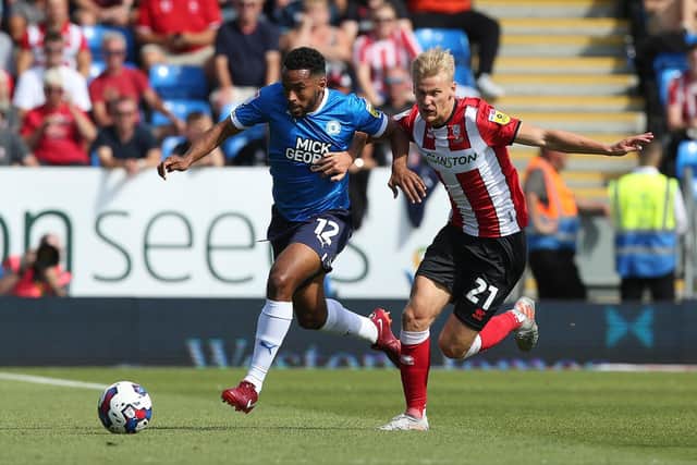 Nathan Thompson of Posh in action against Lincoln City earlier this season. Photo: Joe Dent/theposh.com.