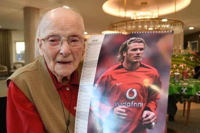 David Beckham superfan Mona Hurry, 102, with her favourite Beckham calendar
