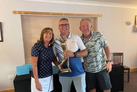 Men's winner Neil Shaylor flanked by Kim and Nick Markillei at the Daniel Markillie Memorial Day at Gedney Hill Golf Club.