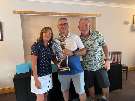 Men's winner Neil Shaylor flanked by Kim and Nick Markillei at the Daniel Markillie Memorial Day at Gedney Hill Golf Club.