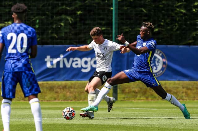 Posh star Ronnie Edwards in action with Tammy Abraham of Chelsea in a pre-season friendly in July 2021.