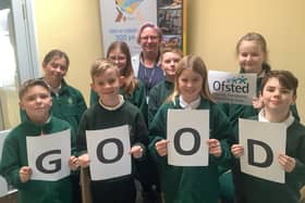 Upwood Primary Academy pupils celebrate their school's Good Ofsted rating.