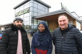 Faisal Mokhammad Aiup and Moneera Taher with Don MacLarty from PARCA outside Waitrose.