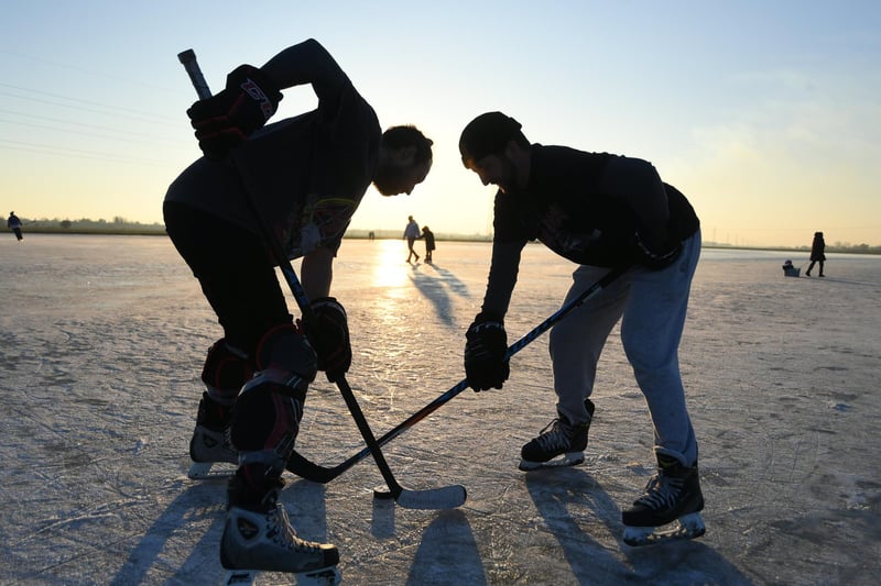 Ice Skating at Whittlesey Wash. Ice hockey players  Ben Livermore and Ryan Kemp take advantage of the freezing temperatures in January
