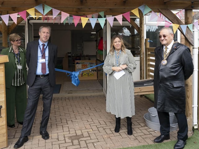 Mayor of Peterborough Cllr Marco Cereste, right, prepares to cut the ribbon.