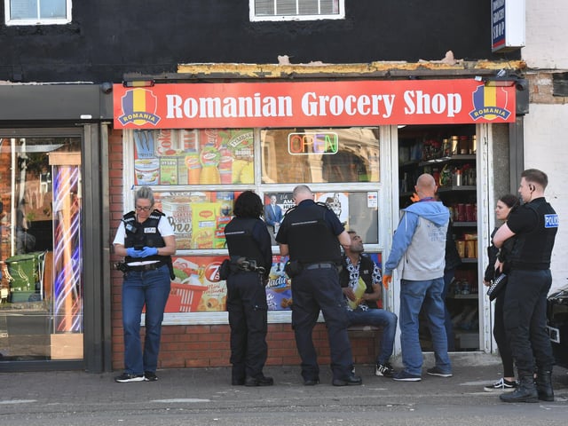 Police and HM Customs at one of the raids at Lincoln Road