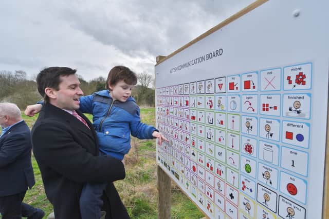 New autism communication board installed at Holywell Ponds, Longthorpe. Daniel Harris and his son