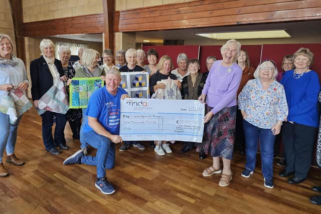 Winning and Simon at the cheque presentation.