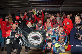 Peterborough Panthers fans and riders at the end of the meeting together with the trophy. Photo Andy Dann