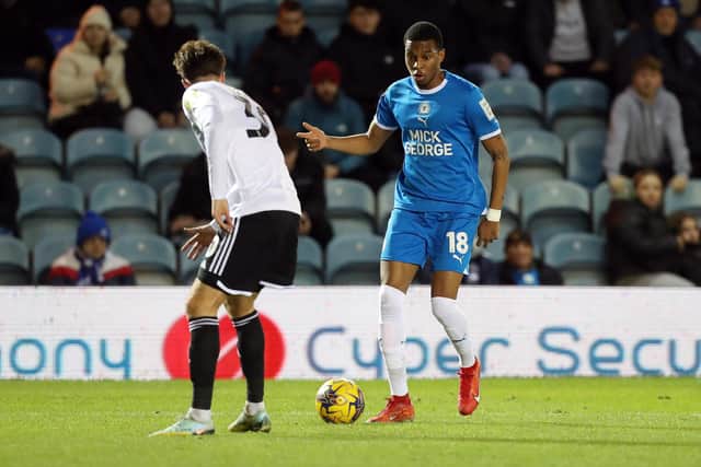 Malik Mothersille of Peterborough United takes on a Crawley Town defender. Photo: Joe Dent/theposh.com