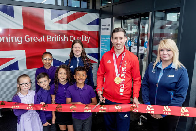 From left, Rebecca Scott, Paralympian gold medal winner Jonathan Broom-Edwards, store manager Michelle Wilson  with children from New Road Primary School at the opening of the new Aldi supermarket in Whittlesey.