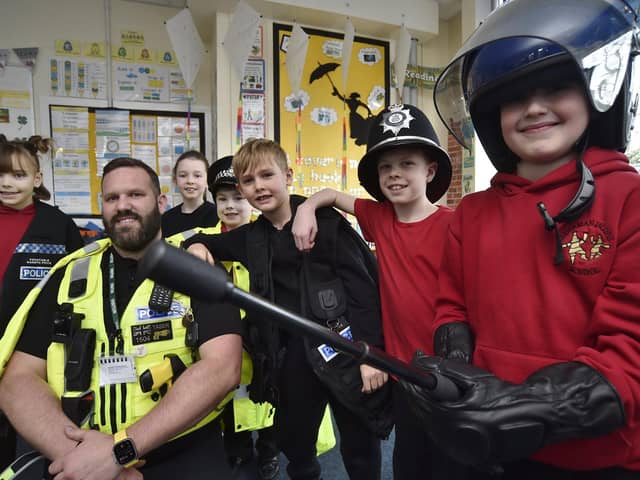 PC Gareth Price,  a safety in schools officer with some of the pupils.