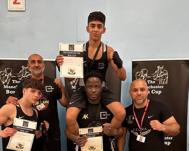 Aamir Shirazi is lifted up by clubmate Amat Jobe with Shae Gowler and Top Yard Boxing club coaches also pictured in Manchester