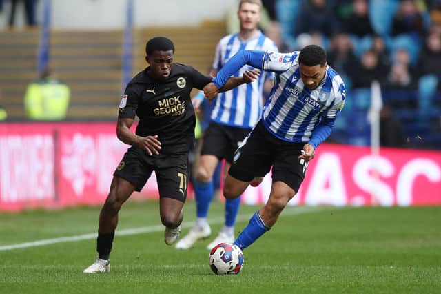 Kwame Poku of Peterborough United takes on Jaden Brown of Sheffield Wednesday. Photo: Joe Dent/theposh.com