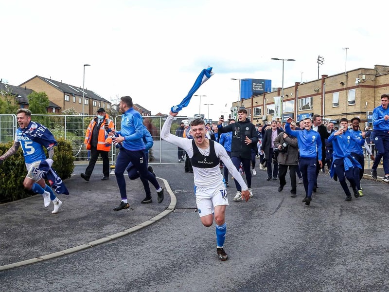 Harrison Burrows celebrates promotion from League One in May, 2021.