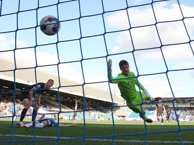 Jonson Clarke-Harris heads in Peterborough United's opening goal. Photo: Joe Dent.
