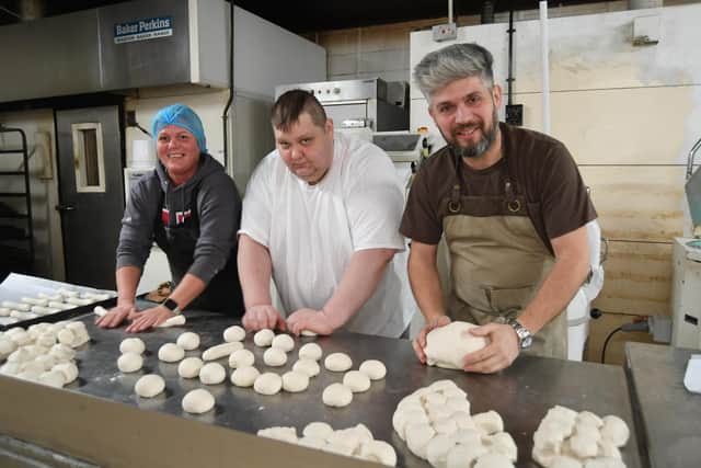 Damian Wawrzyniak with his staff in the bakery at Towler Street, Peterborough