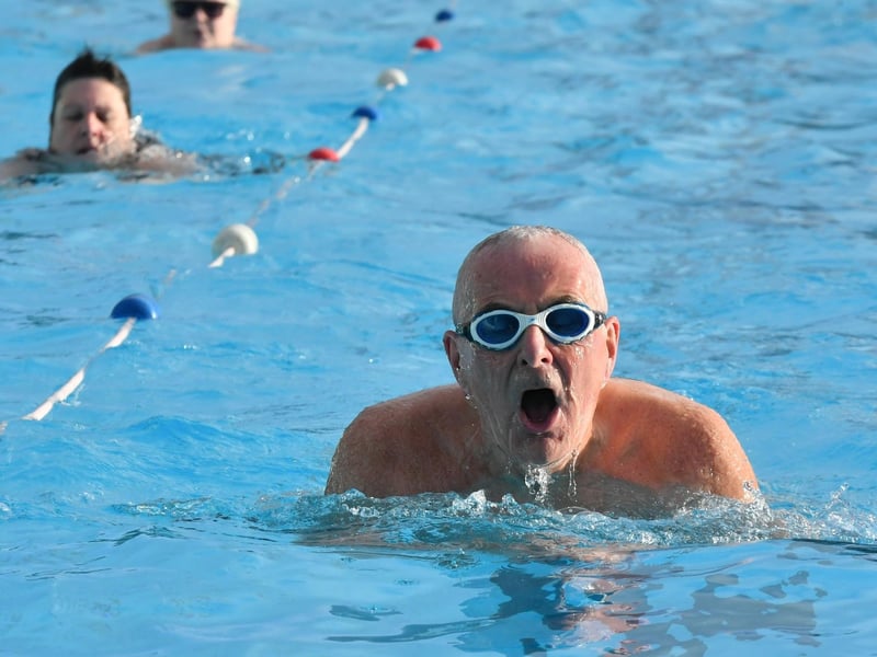 Swimmers enjoy some morning sun.
