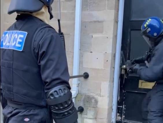 Police raided the homes in Lincoln Road and St Mary's Court.