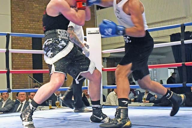 Police Club boxer Mohammed Ihtishaam (right) throws a punch in St Ives.