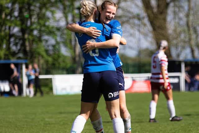 Evie Driscoll-King celebrates her winning goal for Posh Women with Keir Perkins. Photo: Ruby Red Photography