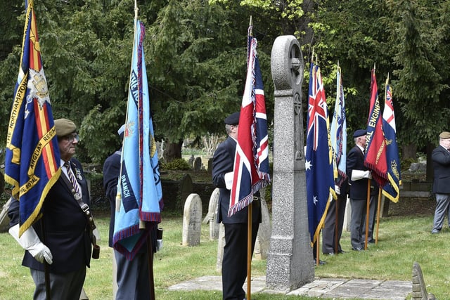 Royal British Legion standard bearers at the grave of Sgt Hunter