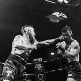 Martin Reffell (left) in British title fight action against Rolando Dy. Photo Brooklyn Freeman.
