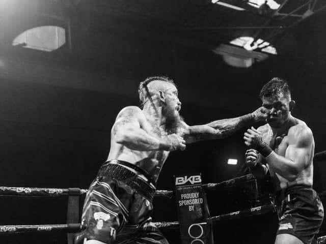 Martin Reffell (left) in British title fight action against Rolando Dy. Photo Brooklyn Freeman.