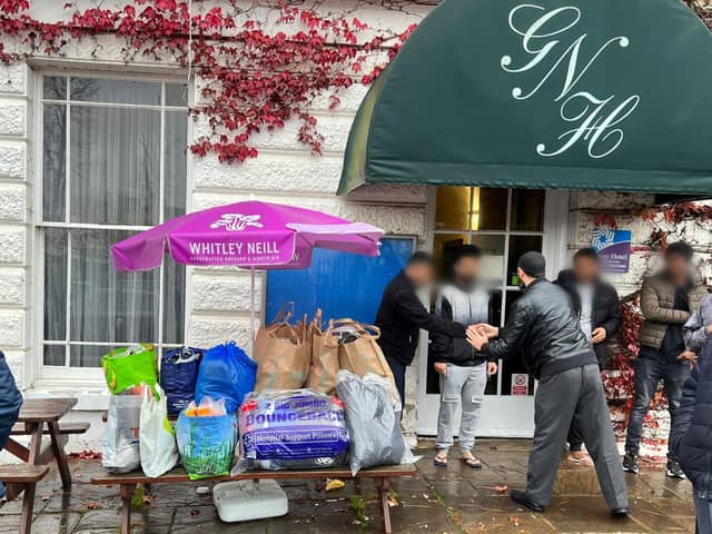 Emergency donations of clothing are brought to the Great Northern Hotel by members of the United Afghan Community Association of Peterborough for about 80 asylum seekers who have been moved to the premises by the Home Office.
