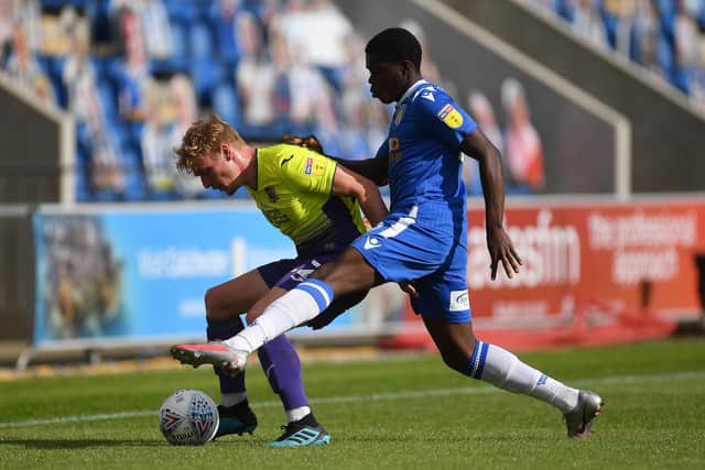 Kwame Poku (blue) in action for Colchester against Exeter in the 2020 League Two play-offs. Photo:Justin Setterfield/Getty Images.