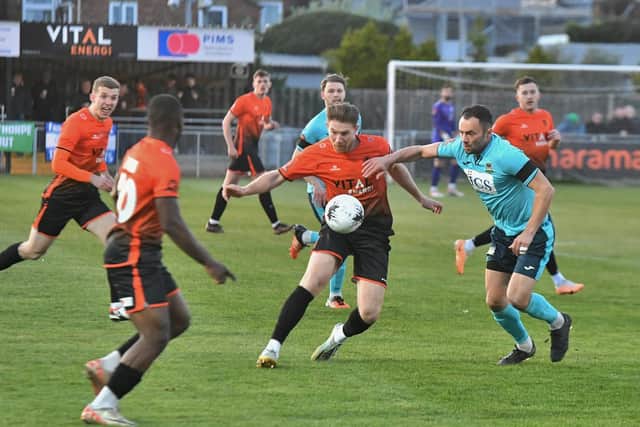 Mark Jones (orange) in action for Peterborough Sports (orange) v Farsley Celtic. Photo David Lowndes.