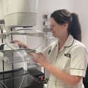 Trust radiographer Rachel Reed with the screening scanner. 